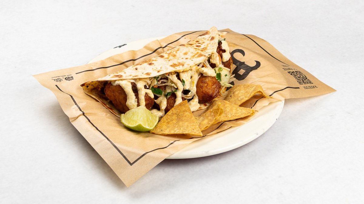 Quesadilla Baja Veggie – Soft wheat tortilla, corn aioli sauce, melted mozzarella che...